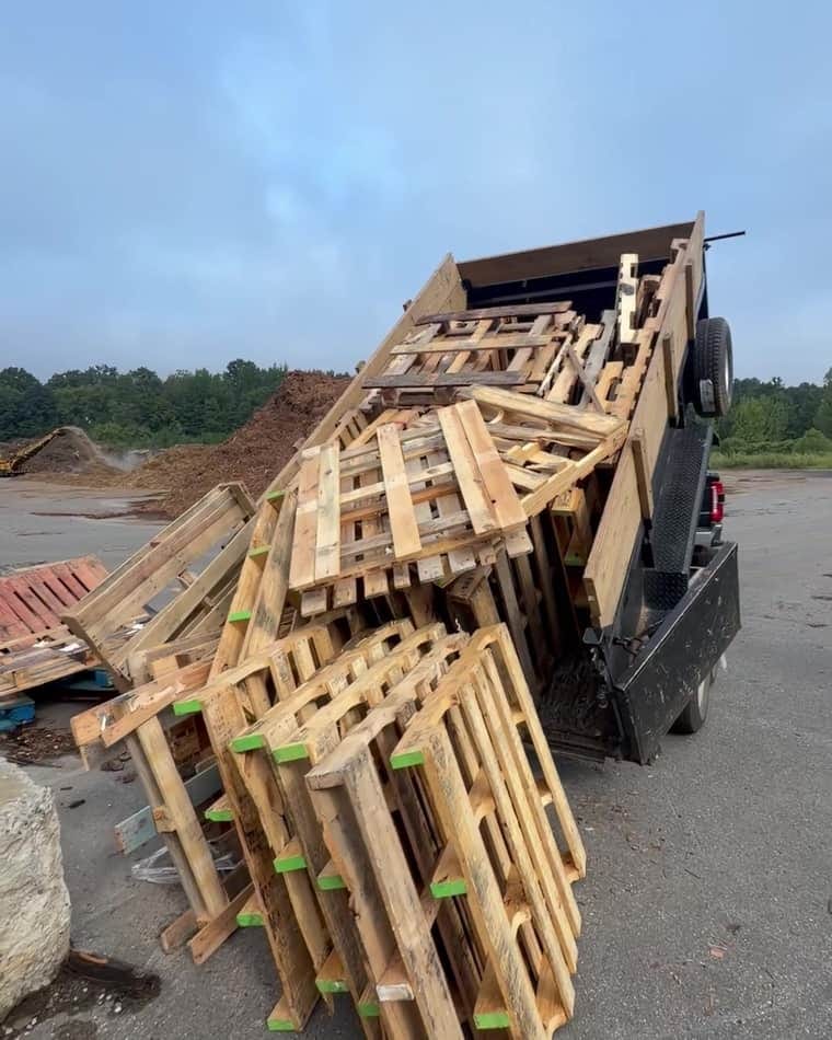 The pallets loaded onto the dump truck and delivered to the recycling yard