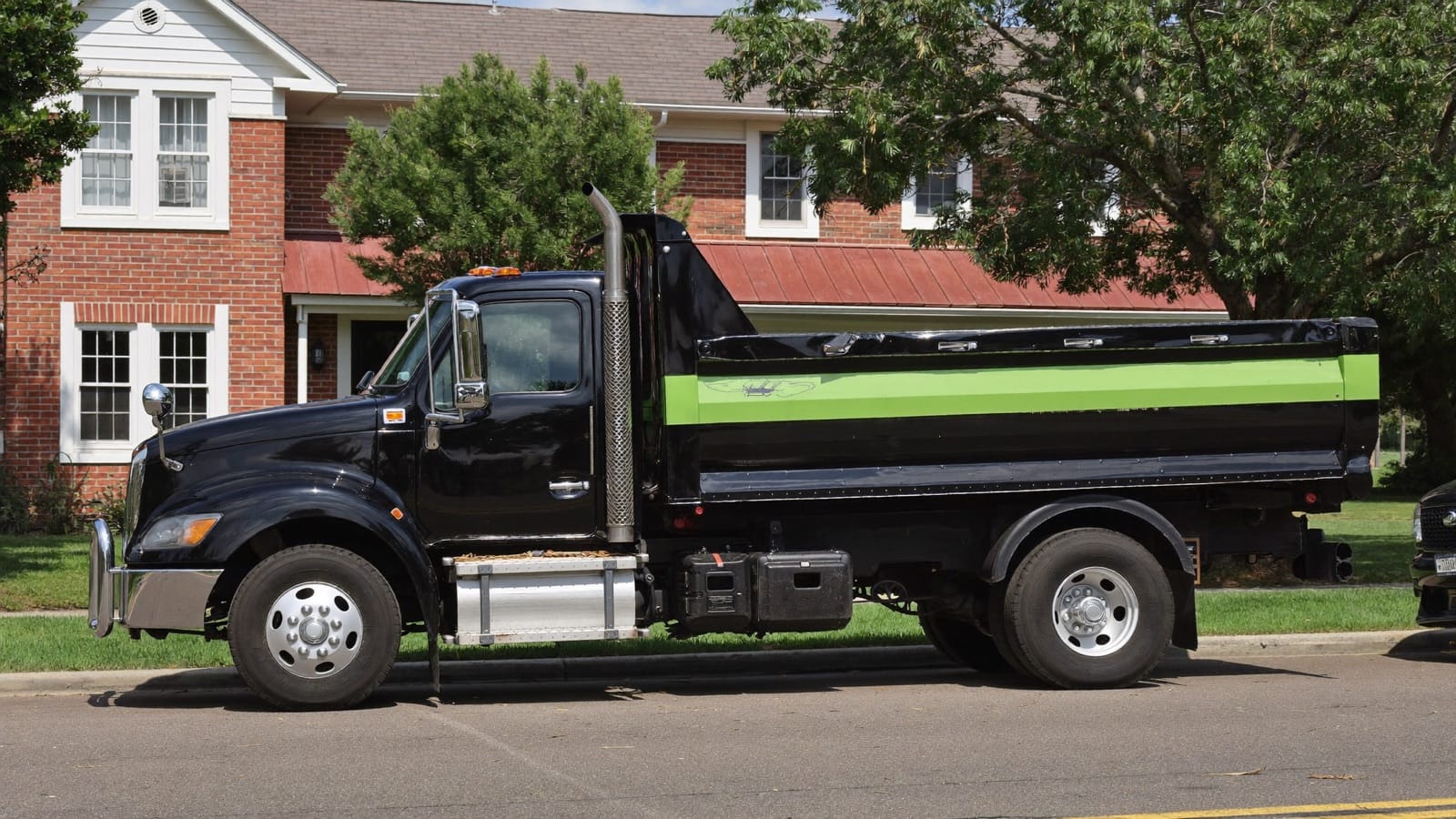 The Junk Boys 15-yard dump truck parked on a Charlotte street
